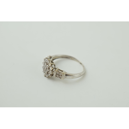 22 - 9ct white gold ring set with diamonds, floral style, 2.3g, size M.