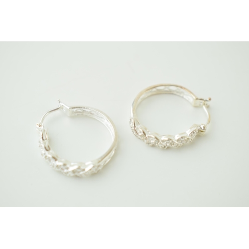 24 - A pair of silver ornate hoop earrings, 4.0g (2).