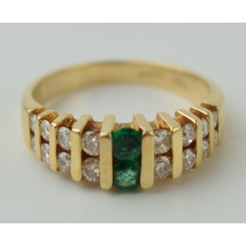 25 - Diamond & emerald set dress ring, set in 14ct gold with 16 diamonds and two emeralds, size M, weight... 