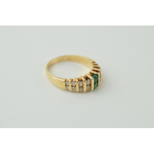 25 - Diamond & emerald set dress ring, set in 14ct gold with 16 diamonds and two emeralds, size M, weight... 