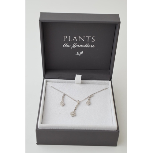 26 - 9ct white gold jewellery set to include a pair of earrings with a pendant and chain, all diamond set... 