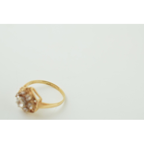 3 - 9ct gold ring with white stones in the form of a flower head, 2.1g, size K/L.