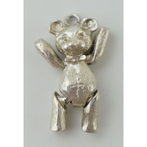 39 - Sterling silver articulated charm in the form of a teddy bear, 4.3g, 22mm.