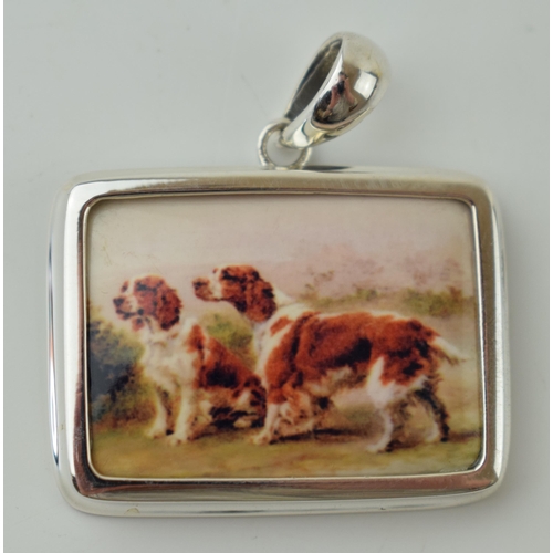 46 - Contemporary silver and enamel pendant with spaniels, 34mm wide.