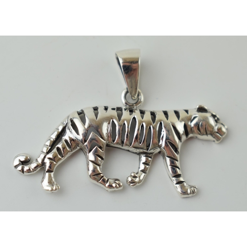 47 - Contemporary silver pendant in the form of a stalking tiger, 4.2g, 40mm wide.