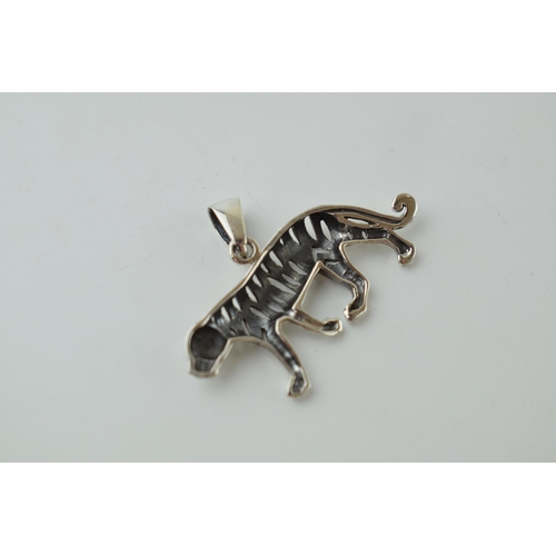 47 - Contemporary silver pendant in the form of a stalking tiger, 4.2g, 40mm wide.