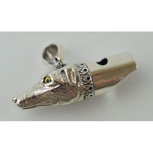 49 - Contemporary silver whistle in the form of a dog's head, 10.0g, 37mm wide.