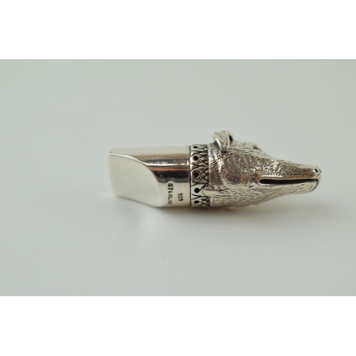 49 - Contemporary silver whistle in the form of a dog's head, 10.0g, 37mm wide.