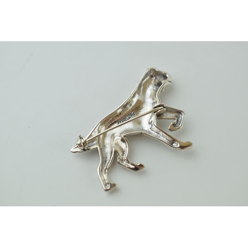 54 - Contemporary silver brooch in the form of a running dog, 10.0g, 4.5cm wide.