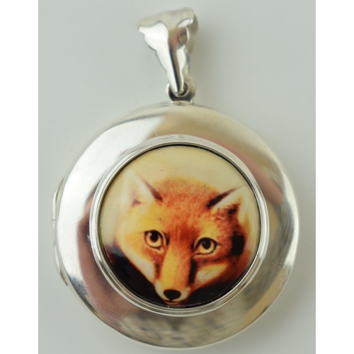 55 - Contemporary silver locket with fox head enamelled decoration, 13.5g, 33mm wide.