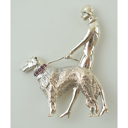 58 - Contemporary silver brooch in the form of a lady walking her dog, Art Deco style, 9.9g, stone set co... 