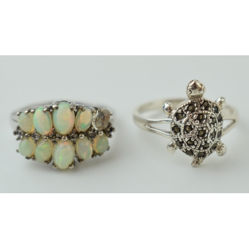 62 - A pair of silver 925 rings to include a tortoise, size R, and an opal set ring, size N/O, combined 6... 