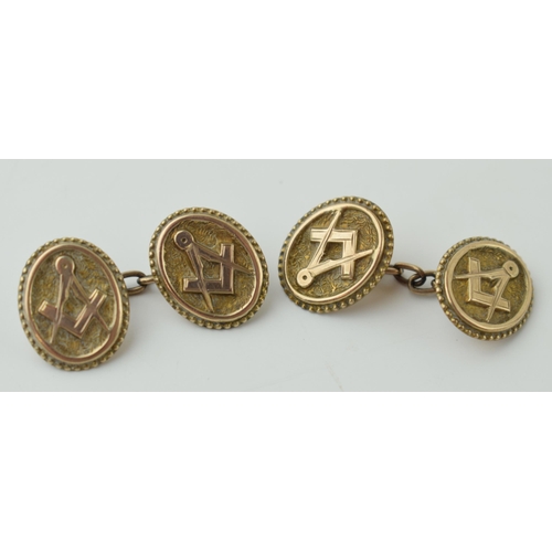 66 - A pair of gilt metal masonic cufflinks (2).