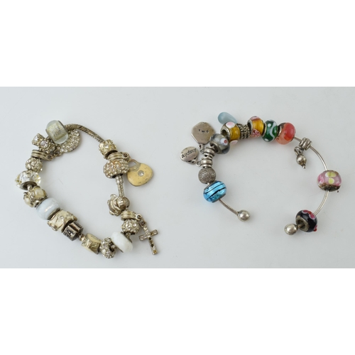 79 - A pair of decorative costume bracelets, set with stones, Pandora style (2).