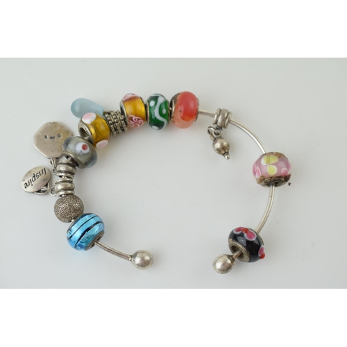 79 - A pair of decorative costume bracelets, set with stones, Pandora style (2).