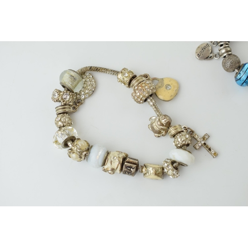 79 - A pair of decorative costume bracelets, set with stones, Pandora style (2).