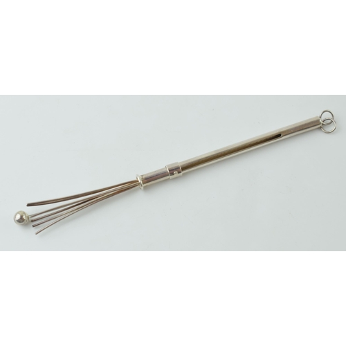 84 - Silver (tests as) retractable cocktail stirrer with working mechanism, 12cm long when extended.