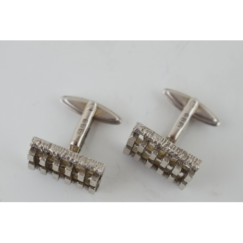 124 - A pair of sterling silver cufflinks with textured design, 14.4 grams (2).