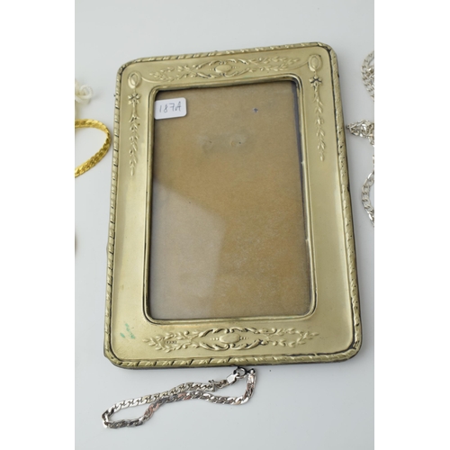 145 - Jewellery to include a silver chain and bracelet, combined 22.0 grams,  silver plated photoframe, a ... 