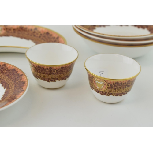 115 - De Lamerie Fine Bone China, heavily gilded, in the Winter Leaves pattern to include two tea cups, th... 