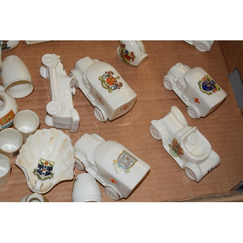 120 - A large and interesting collection of crested china to include vehicles such as Arcadian Harpenden, ... 