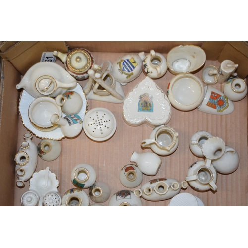 120 - A large and interesting collection of crested china to include vehicles such as Arcadian Harpenden, ... 