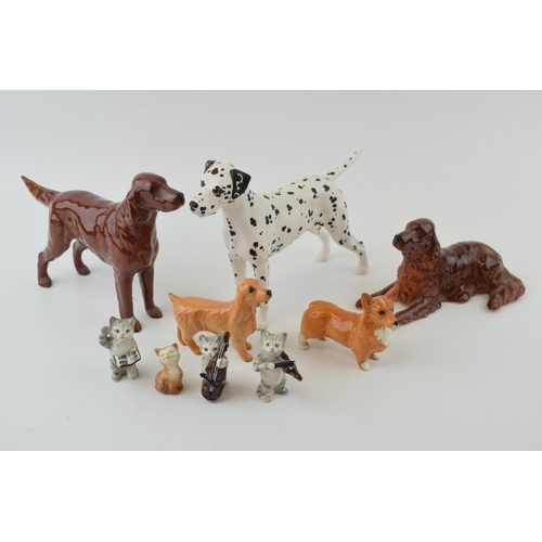 153 - Beswick to include a Dalmatian, a Corgi, a liver coloured spaniel, a lying spaniel, three of the Cat... 