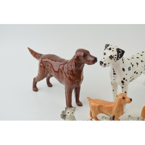 153 - Beswick to include a Dalmatian, a Corgi, a liver coloured spaniel, a lying spaniel, three of the Cat... 