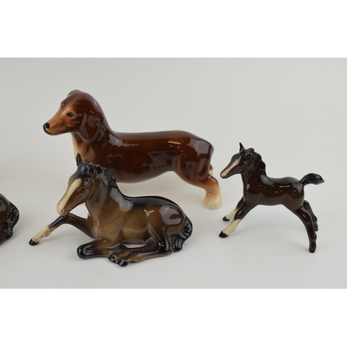 155 - Beswick to include 2 lying foals 915 (1 with Doulton backstop), 2 browns foal, a Sylvac foal and a p... 