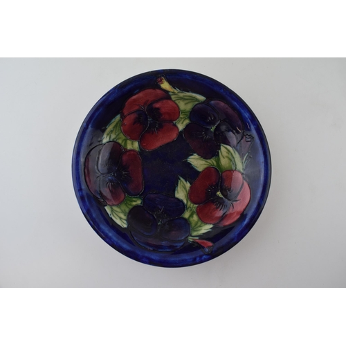 18 - Moorcroft clematis on blue shallow bowl / dish, 19cm wide.