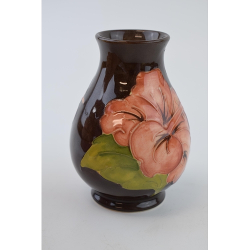 19 - Moorcroft small bulbous vase with Hibiscus on brown, 9.5cm tall.