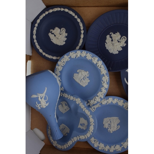 246 - Wedgwood Jasperware in cobalt blue and light blue to include vases, pin dishes and plates etc (9).