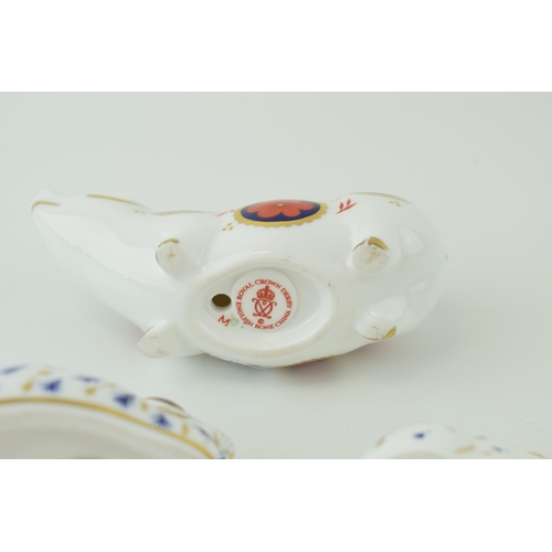 26 - Royal Crown Derby paperweights to include an Imari Pig together with two Rabbits, all first quality ... 