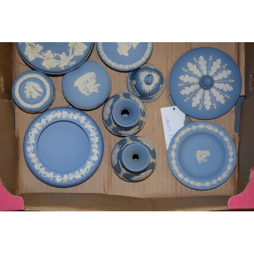 267 - Wedgwood Jasperware in green and blue to include a cup and saucer (cup chipped), vases, a spare urn ... 