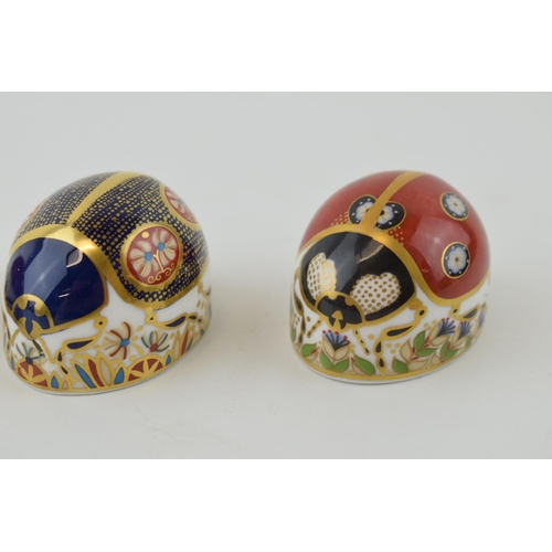 38 - Three Royal Crown Derby Paperweights, Red Ladybird with two spots, Red Ladybird with seven spots and... 