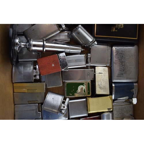 451 - A good and interesting collection of vintage lighters to include makes such as Ronson, Tommy Pipe, M... 