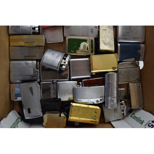 451 - A good and interesting collection of vintage lighters to include makes such as Ronson, Tommy Pipe, M... 