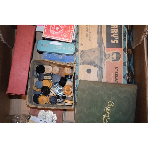 464 - A mixed collection of vintage games, ephemera, advertising tins, postcards and an autograph book. (Q... 