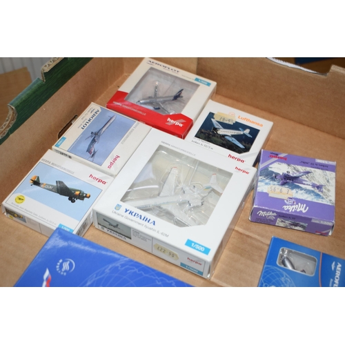 495 - A collection of boxed die cast model planes by 'Herpo' made in Germany, 'Skyteam', '500 Inflight' an... 