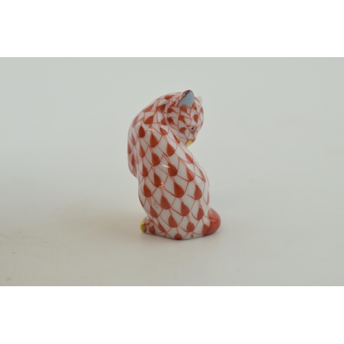 5 - Herend Pottery miniature figure of a cat licking itself, in red fishnet decoration, 4cm tall.