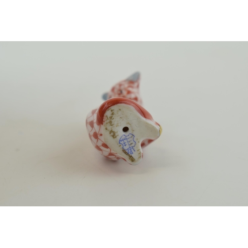 5 - Herend Pottery miniature figure of a cat licking itself, in red fishnet decoration, 4cm tall.