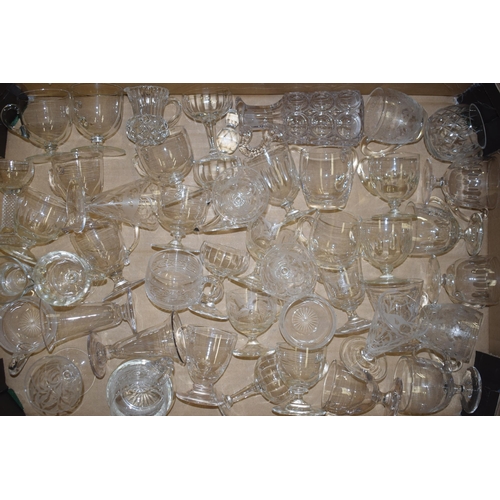 79 - A large collection of Victorian and later custard glasses with varying design, some plain, some etch... 