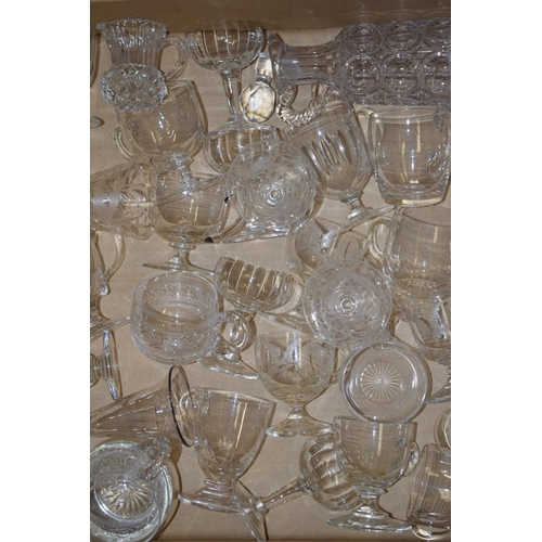 79 - A large collection of Victorian and later custard glasses with varying design, some plain, some etch... 