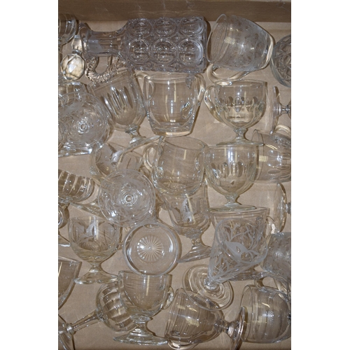 79 - A large collection of Victorian and later custard glasses with varying design, some plain, some etch... 