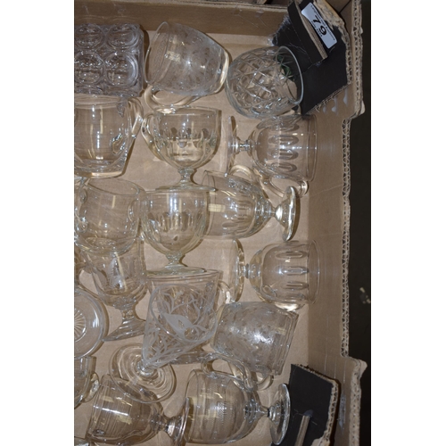 79 - A large collection of Victorian and later custard glasses with varying design, some plain, some etch... 