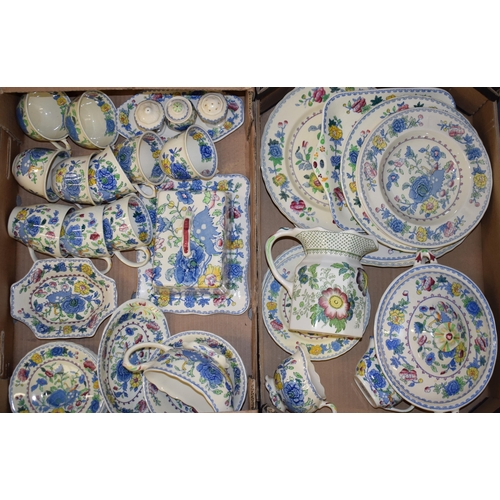 89 - Masons Pottery in the Regency pattern to include a butter dish, a lidded tureen, a cruet set, cups, ... 