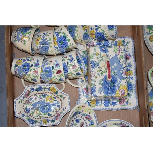 89 - Masons Pottery in the Regency pattern to include a butter dish, a lidded tureen, a cruet set, cups, ... 