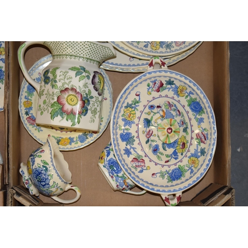 89 - Masons Pottery in the Regency pattern to include a butter dish, a lidded tureen, a cruet set, cups, ... 