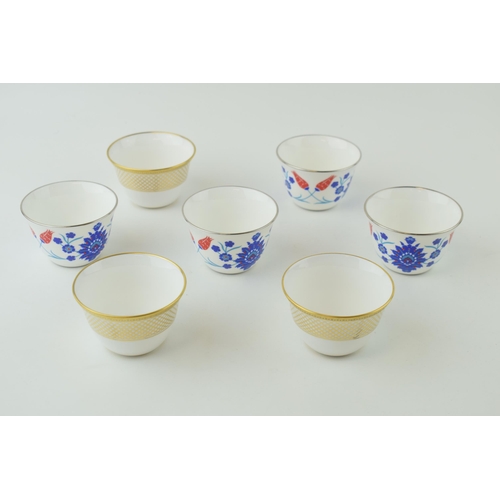 110 - De Lamerie Fine Bone China tea cups to include gold spiral and twist (3) and a floral set (4) (7 in ... 