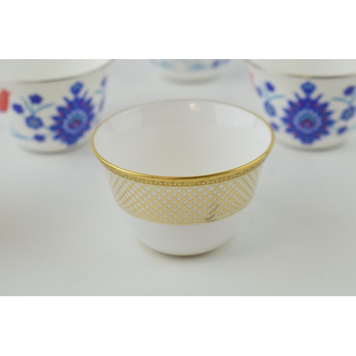 110 - De Lamerie Fine Bone China tea cups to include gold spiral and twist (3) and a floral set (4) (7 in ... 